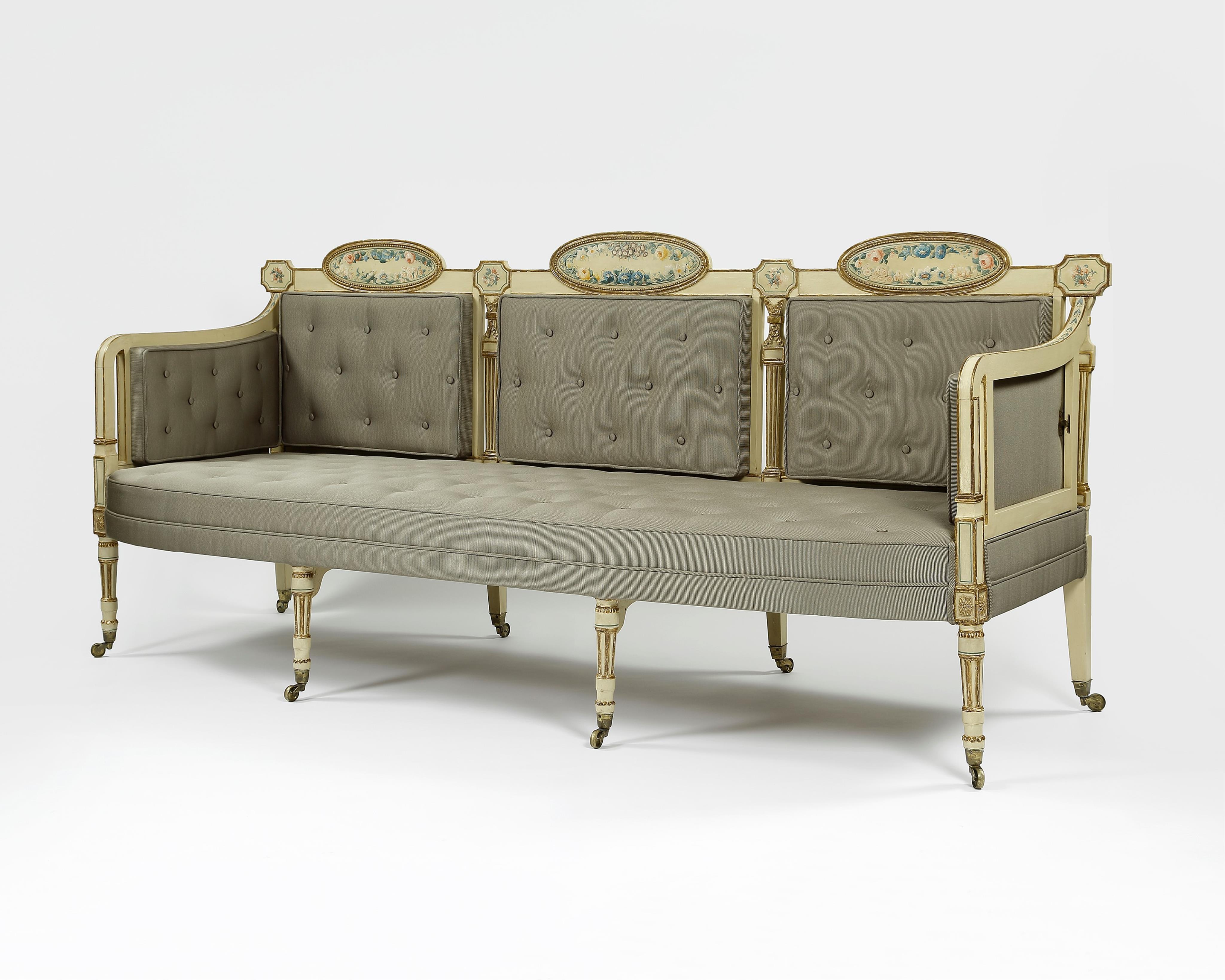 A pair of George III cream painted and parcel gilt settees, in the manner of George Brookshaw (1751-1823)